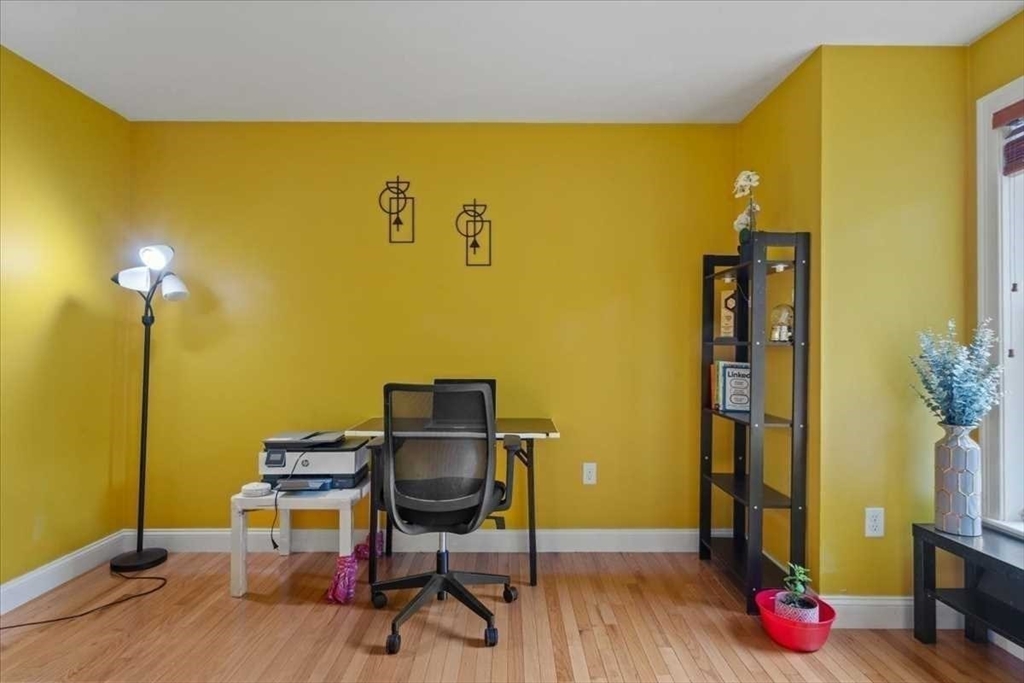 28 McIntosh Drive, Unit 22 Stow, MA 01775 - Photo 19 of 38 a view of workspace with wooden floor