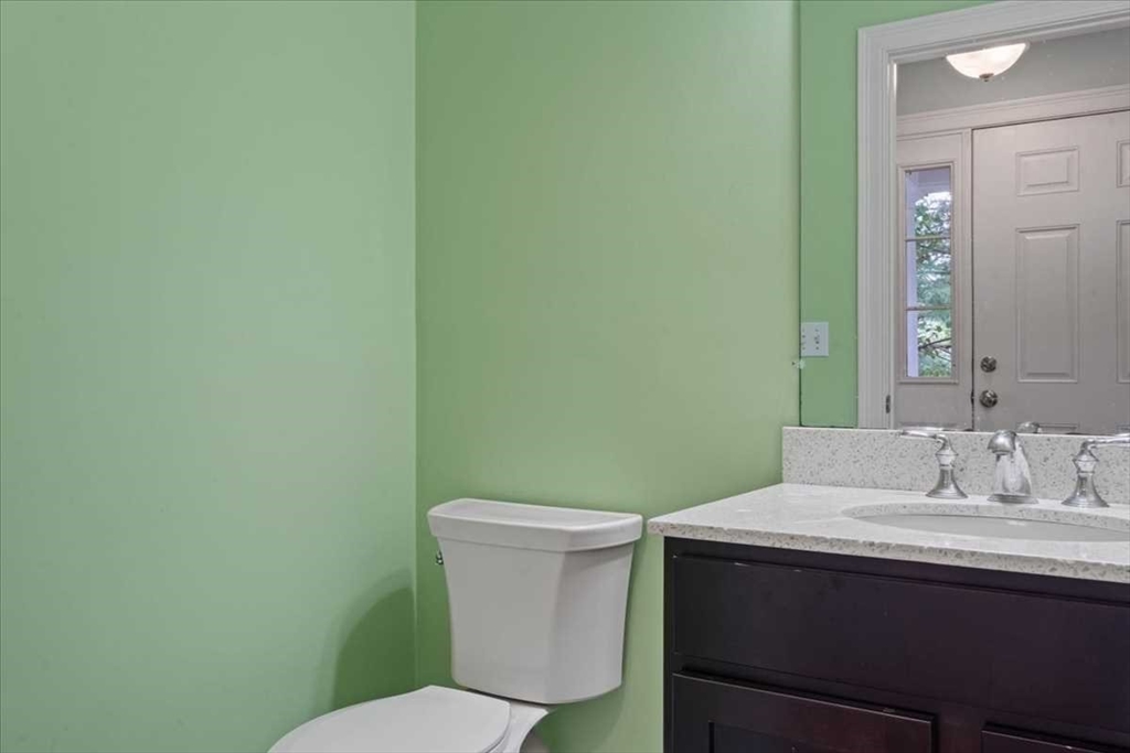 28 McIntosh Drive, Unit 22 Stow, MA 01775 - Photo 33 of 38 a bathroom with a sink and a toilet