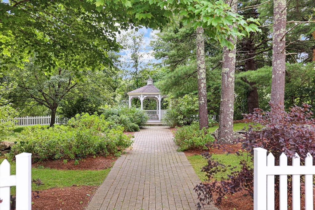 28 McIntosh Drive, Unit 22 Stow, MA 01775 - Photo 35 of 38 a view of house with a yard