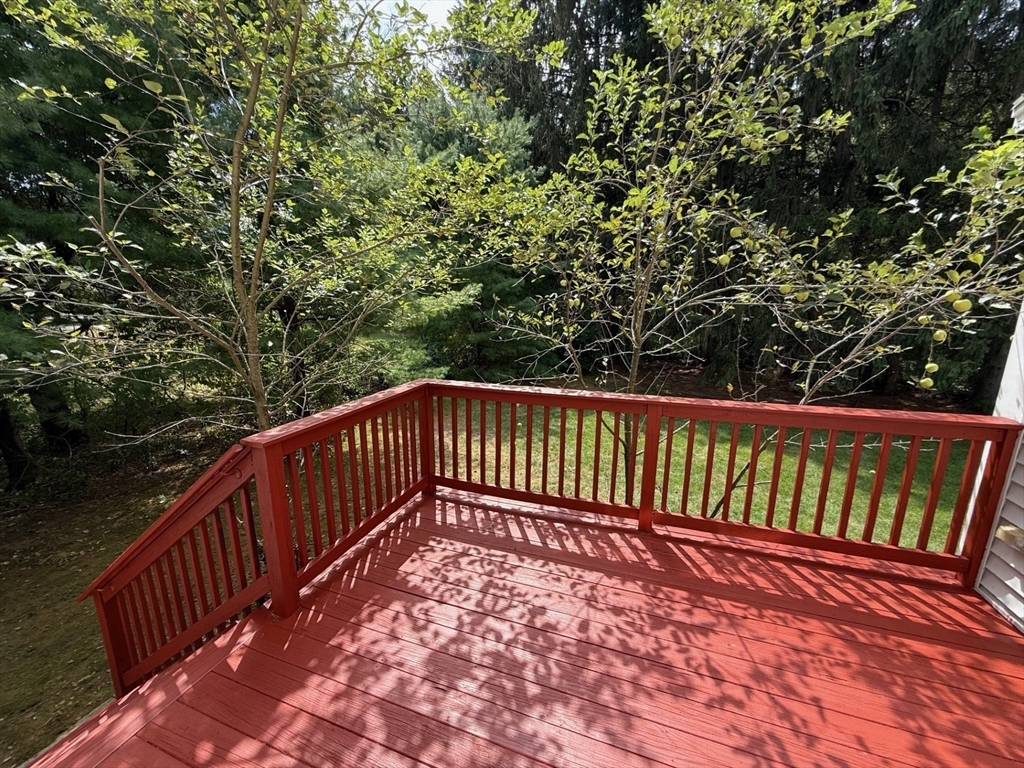 28 McIntosh Drive, Unit 22 Stow, MA 01775 - Photo 6 of 38 a view of balcony with wooden floor