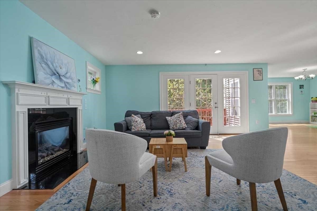 28 McIntosh Drive, Unit 22 Stow, MA 01775 - Photo 7 of 38 a living room with furniture and a fireplace