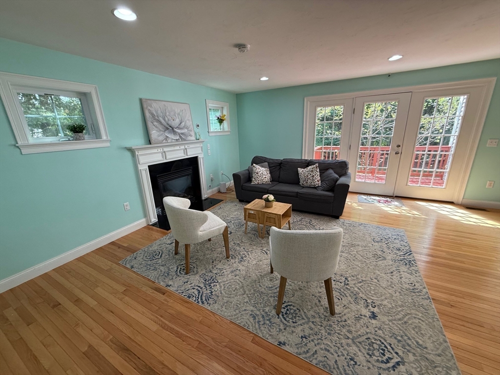 28 McIntosh Drive, Unit 22 Stow, MA 01775 - Photo 10 of 38 a living room with furniture and a window
