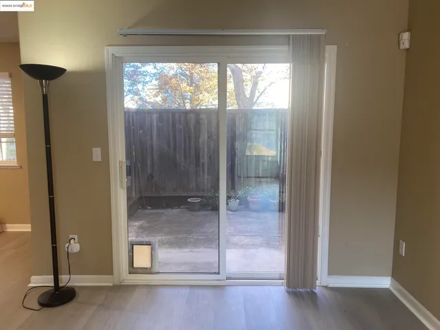 a view of a bathroom with a glass door and shower