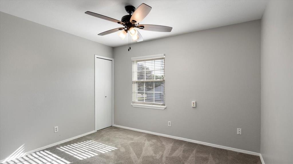 6925 Red Fox Trail Fort Worth, TX 76137 - Photo 14 of 23 Second bedroom with ceiling fan.