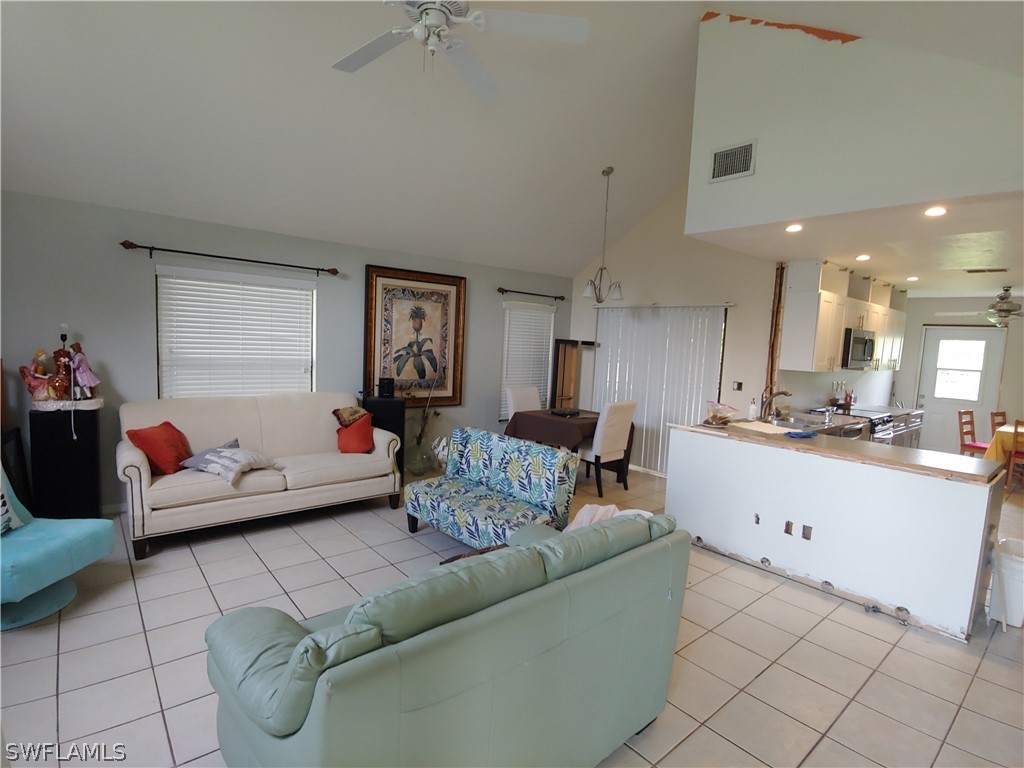 17496 Lebanon Road Fort Myers, FL 33967 - Photo 6 of 21 a living room with furniture and a wooden floor
