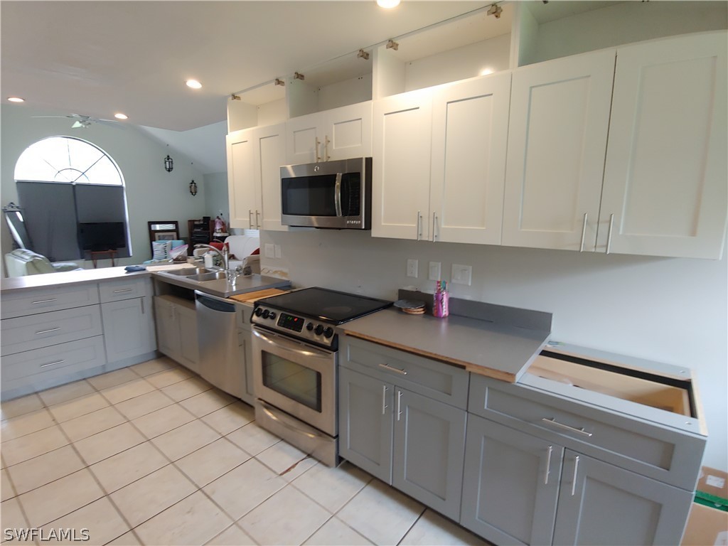 17496 Lebanon Road Fort Myers, FL 33967 - Photo 8 of 21 a kitchen with a sink and cabinets