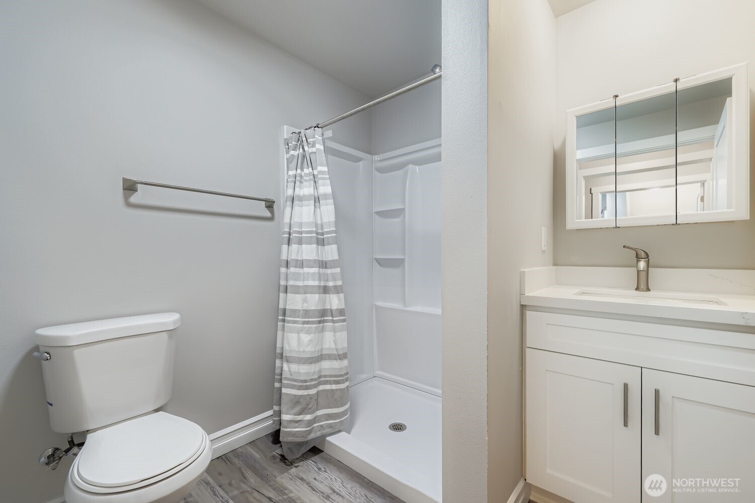 8912 229th Place Southwest, Unit B Edmonds, WA 98026 - Photo 13 of 25 a bathroom with a granite countertop sink toilet and shower