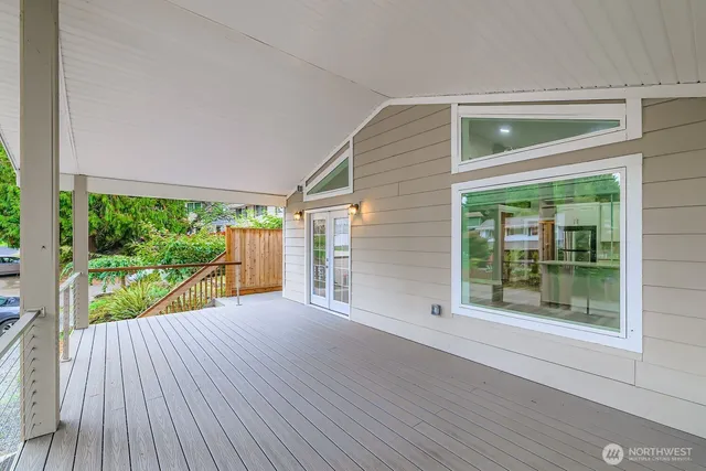 a view of a balcony with wooden floor