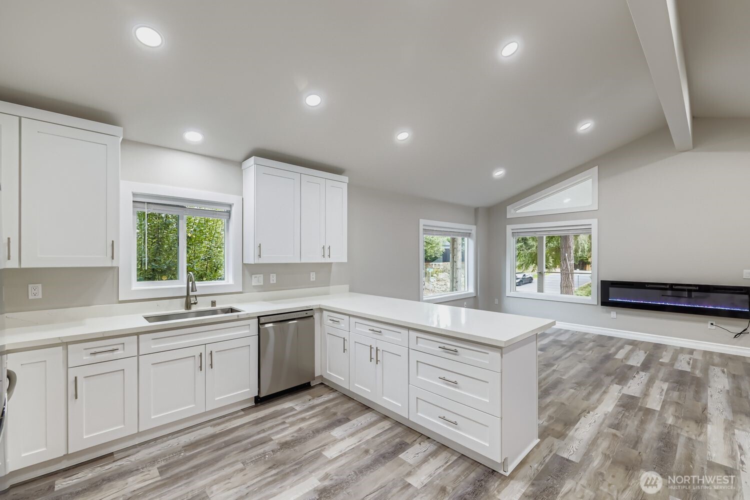 8912 229th Place Southwest, Unit B Edmonds, WA 98026 - Photo 7 of 25 a large white kitchen with a large window