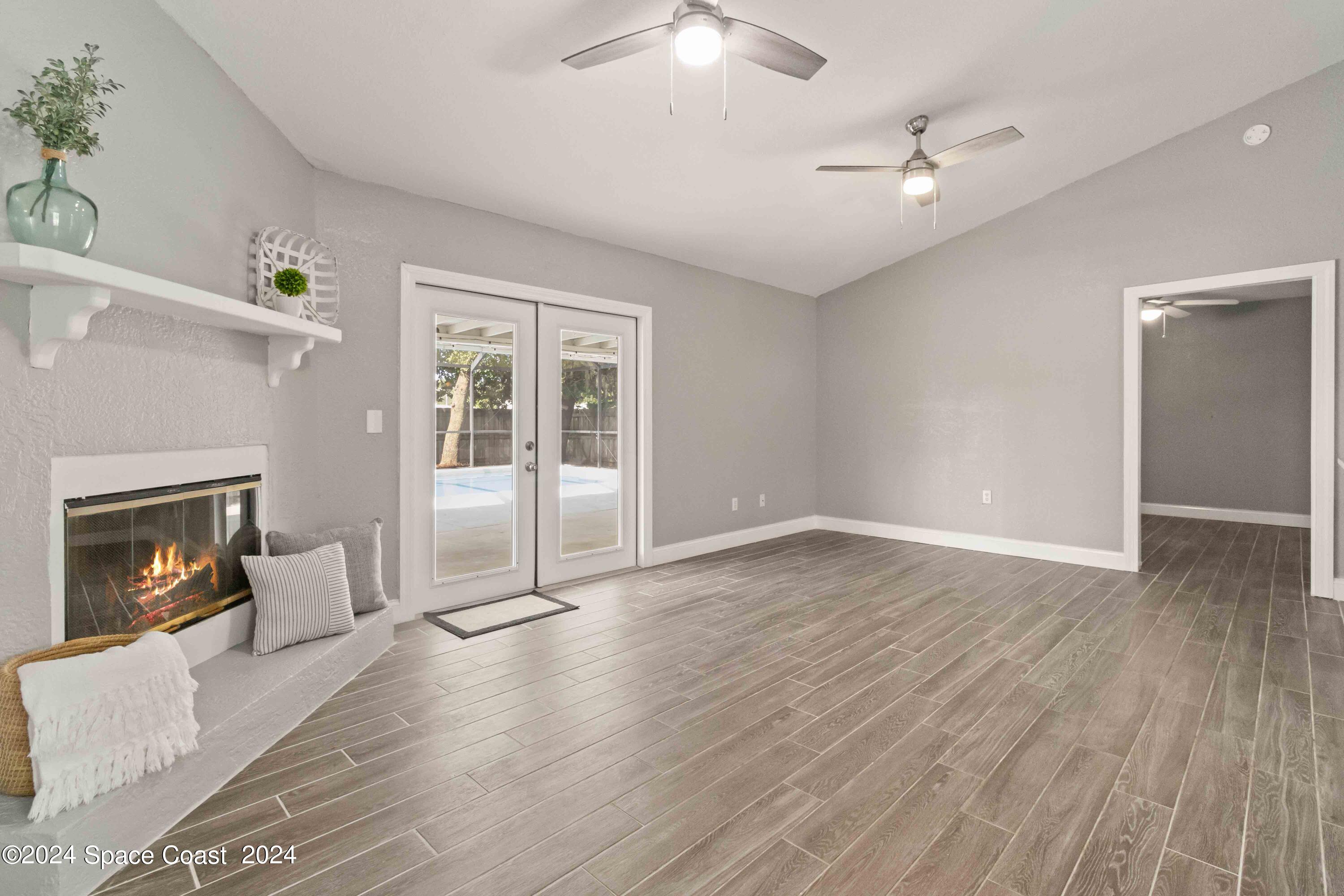 6846 Hartford Road Cocoa, FL 32927 - Photo 10 of 19 Family Room With Fireplace