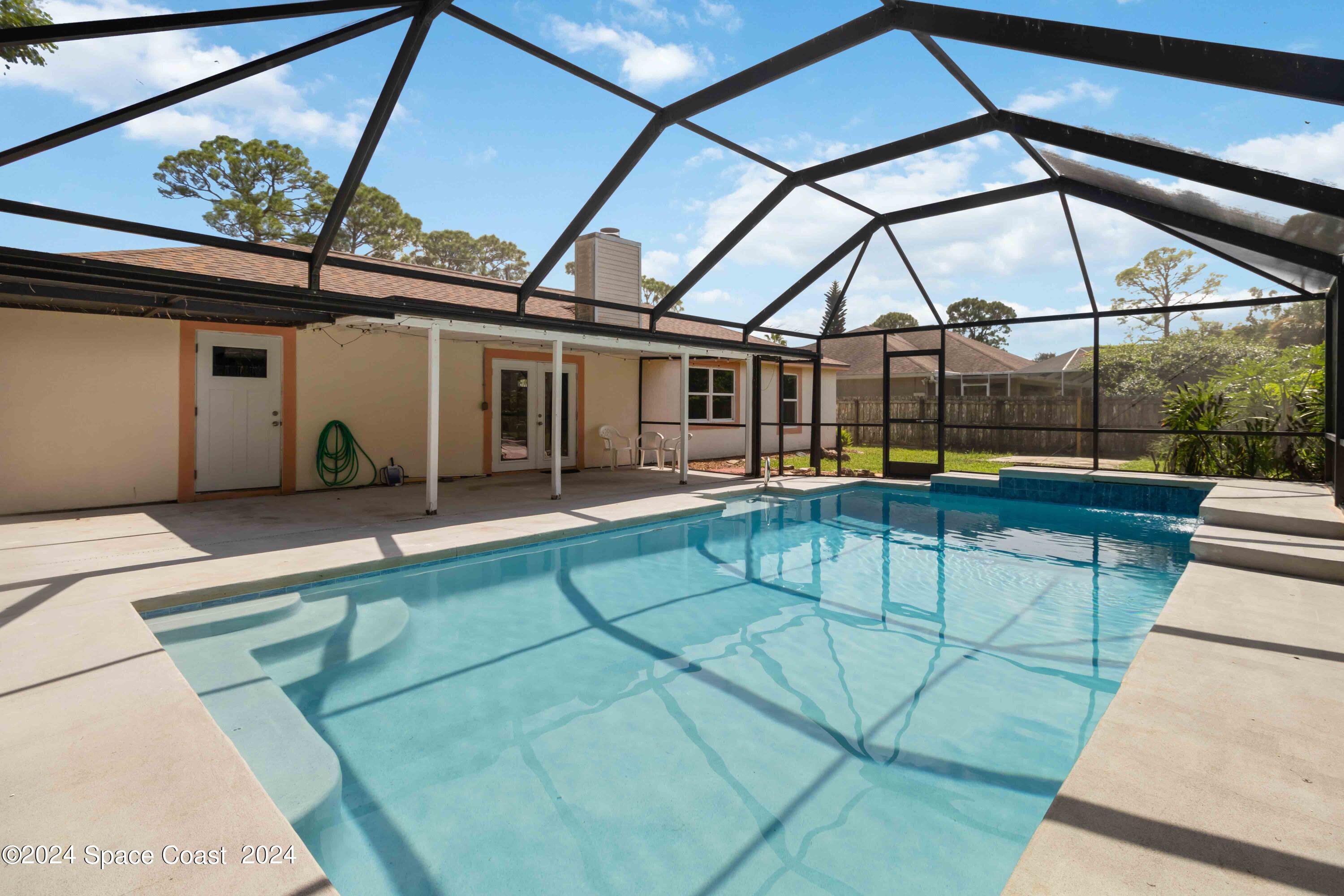 6846 Hartford Road Cocoa, FL 32927 - Photo 17 of 19 Screened Enclosure and Large Porch