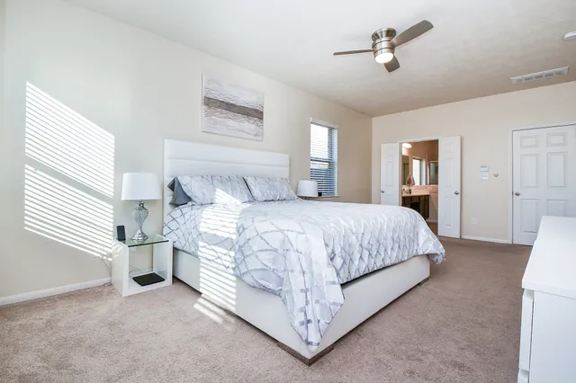 a bedroom with a bed and window