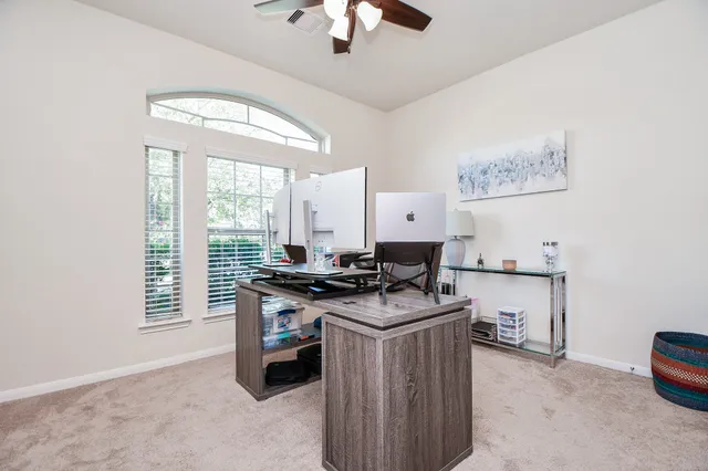 a spacious bathroom with a bathtub and a large mirror