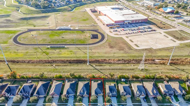 a view of a house with backyard and porch