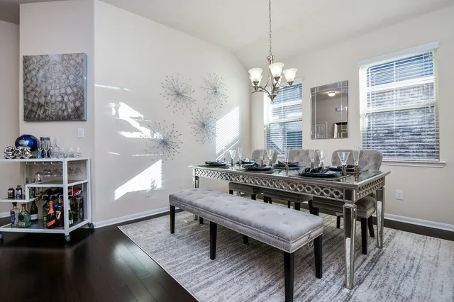 a view of a livingroom with furniture and a chandelier