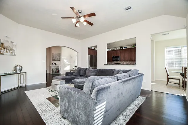 a living room with furniture and a large window
