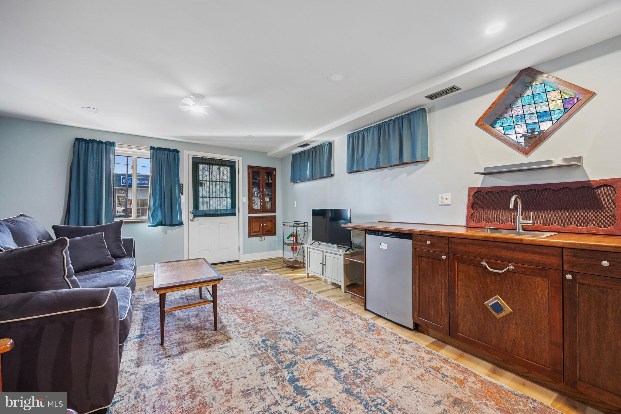 1155 Easton Road Abington, PA 19001 - Photo 15 of 35 a living room with furniture a piano and a sink