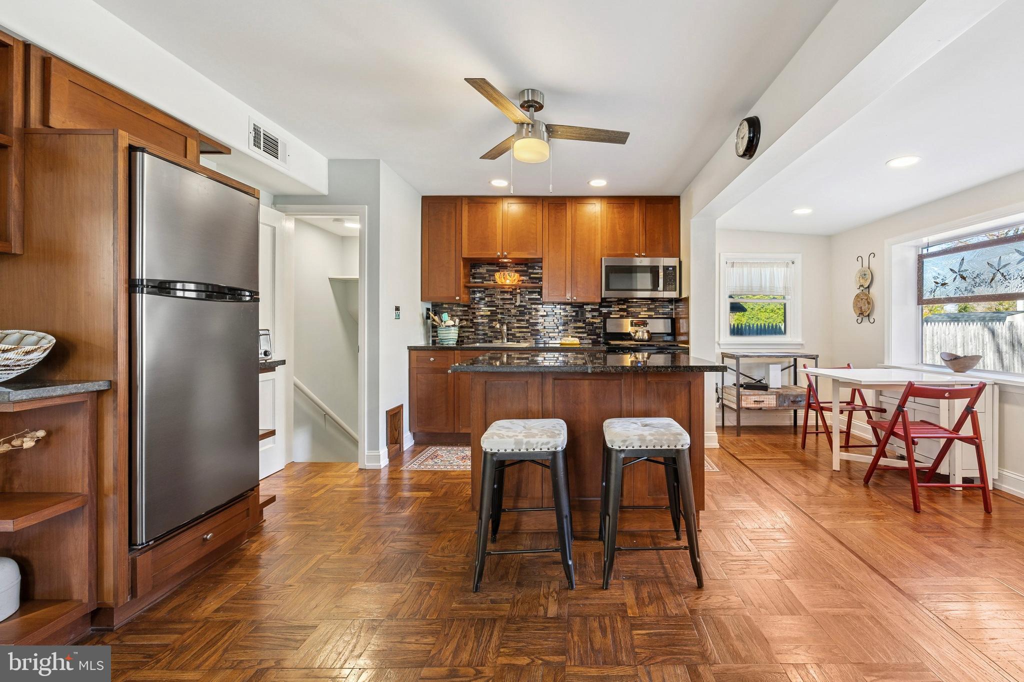 1155 Easton Road Abington, PA 19001 - Photo 9 of 35 a dining hall with stainless steel appliances granite countertop a refrigerator dining table and chairs
