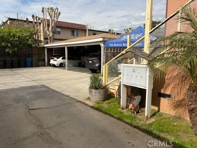 a man walking down a street next to a building