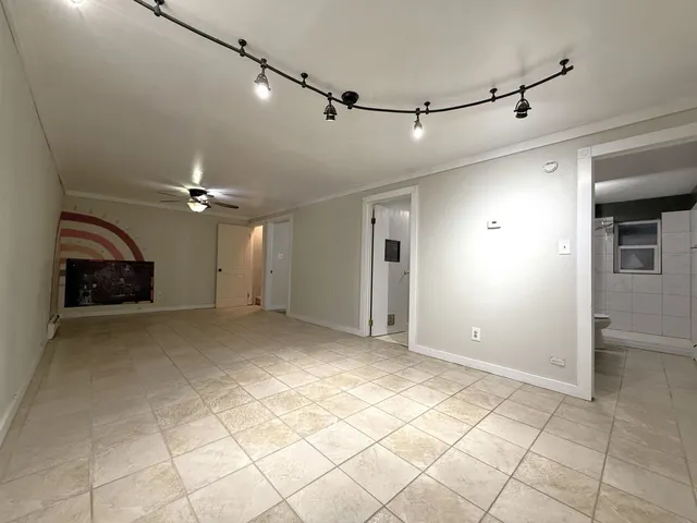 a view of a livingroom with a furniture and a ceiling fan