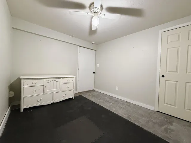 a room with toys and dresser