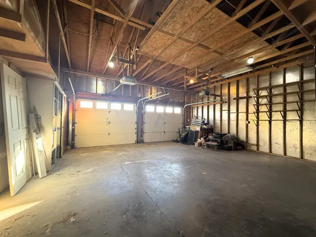 a view of a room with large windows