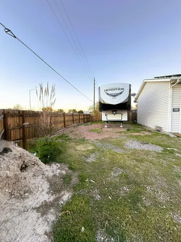 a view of a backyard with jacuzzi