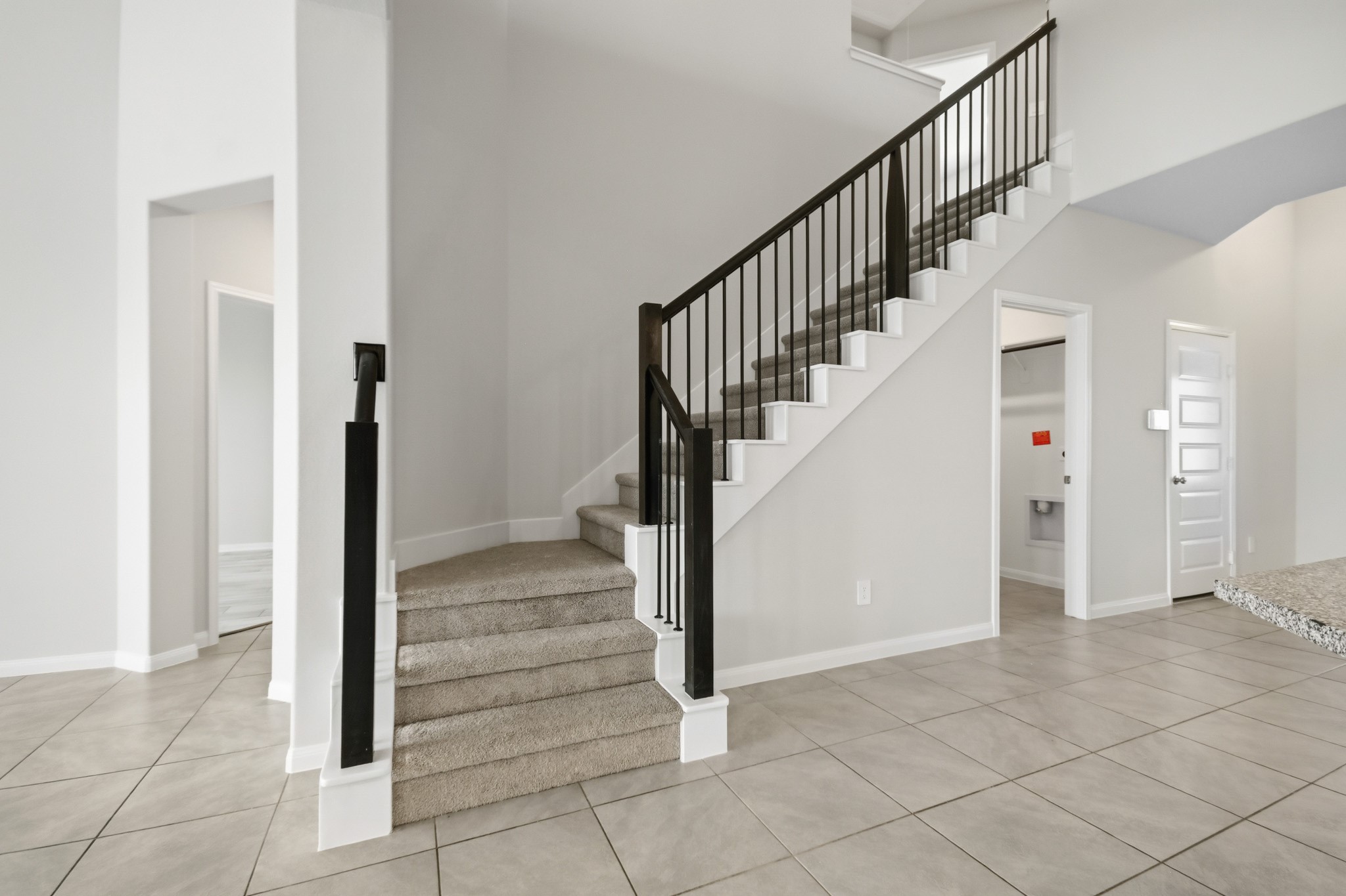 10723 Clfs Vw Drive Rosharon, TX 77583 - Photo 24 of 50 Dark stained stair railing leading upstairs!