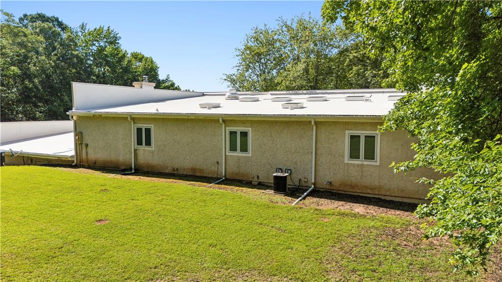 110 Bridger Point Road Fayetteville, GA 30215 - Photo 7 of 7 a view of a house with a backyard