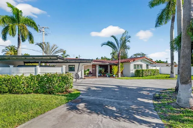 a view of a porch with furniture and a potted plants