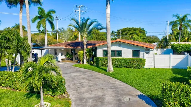 an aerial view of houses with yard