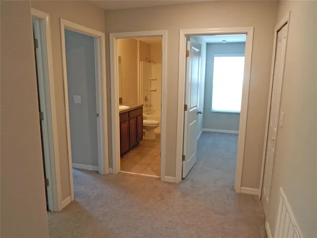 a view of a room that has a large window