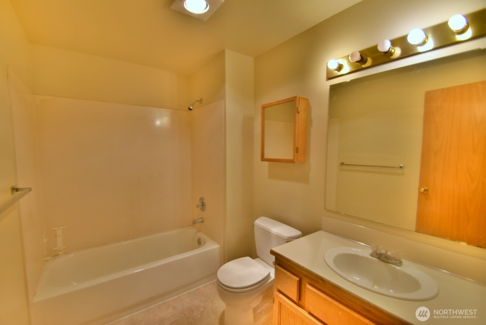 7616 200th Street Southwest, Unit 2 Edmonds, WA 98026 - Photo 12 of 12 a bathroom with a sink toilet and shower