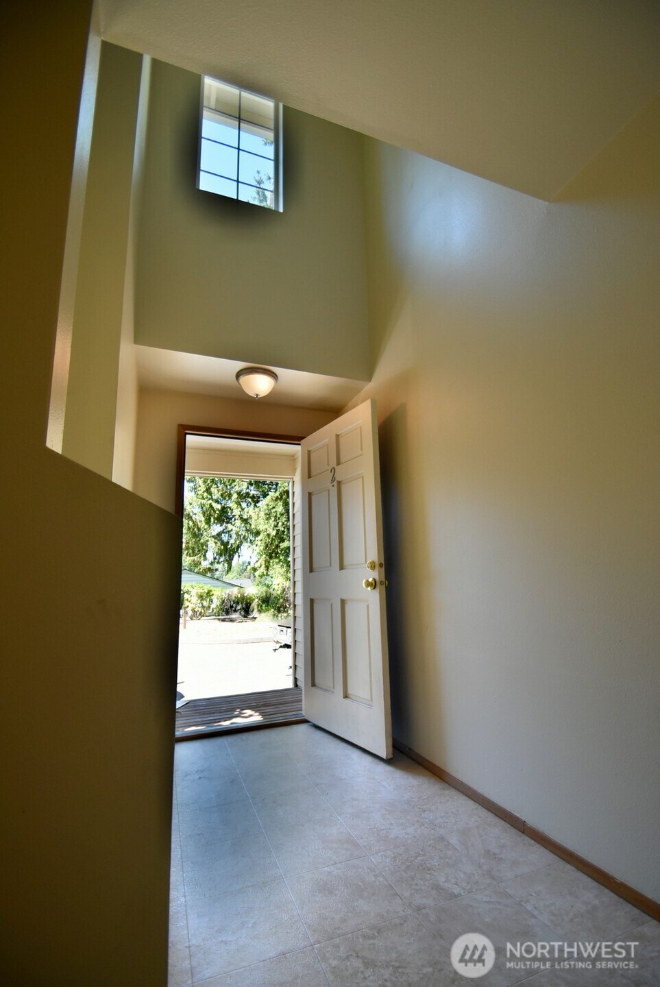 7616 200th Street Southwest, Unit 2 Edmonds, WA 98026 - Photo 2 of 12 an empty room with windows