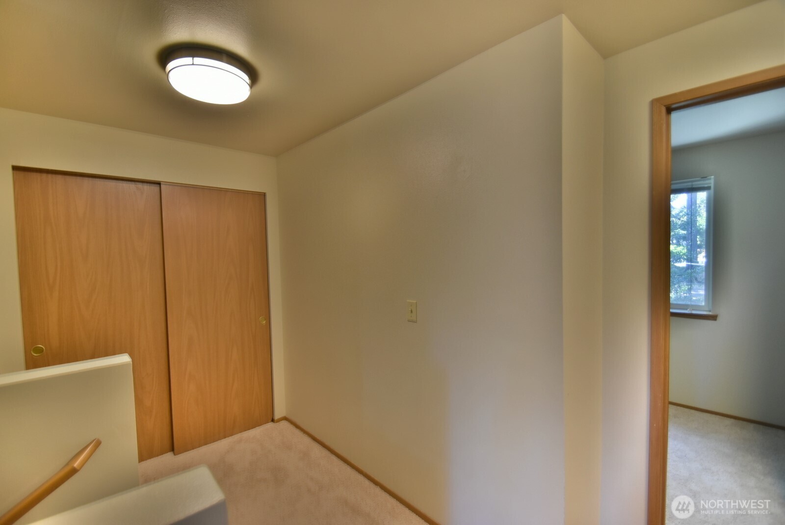 7616 200th Street Southwest, Unit 2 Edmonds, WA 98026 - Photo 6 of 12 a view of a room with wooden floor