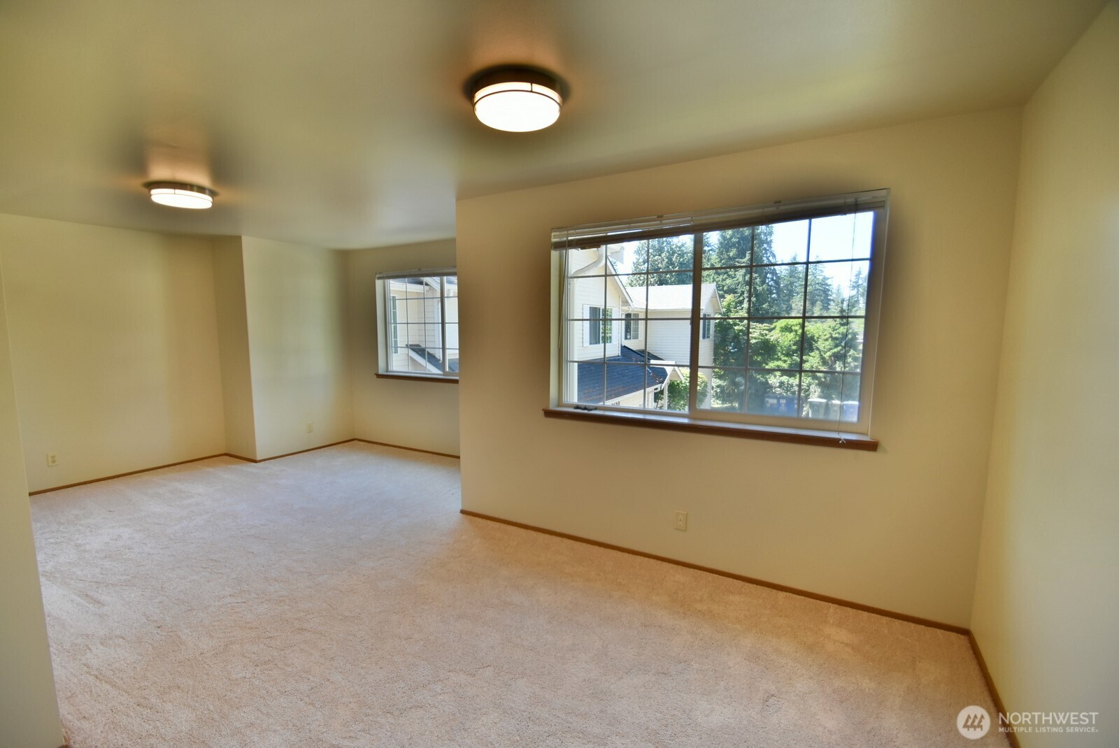 7616 200th Street Southwest, Unit 2 Edmonds, WA 98026 - Photo 7 of 12 an empty room with windows