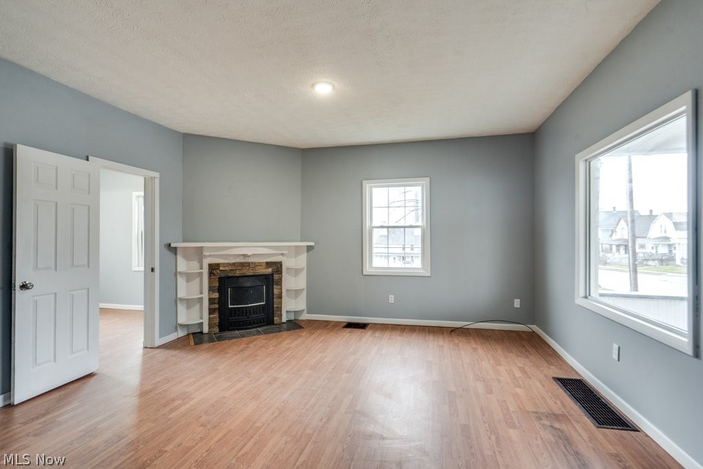 1607 9th Street Southwest Canton, OH 44706 - Photo 7 of 41 Living area featuring wood-finish flooring and light gray walls