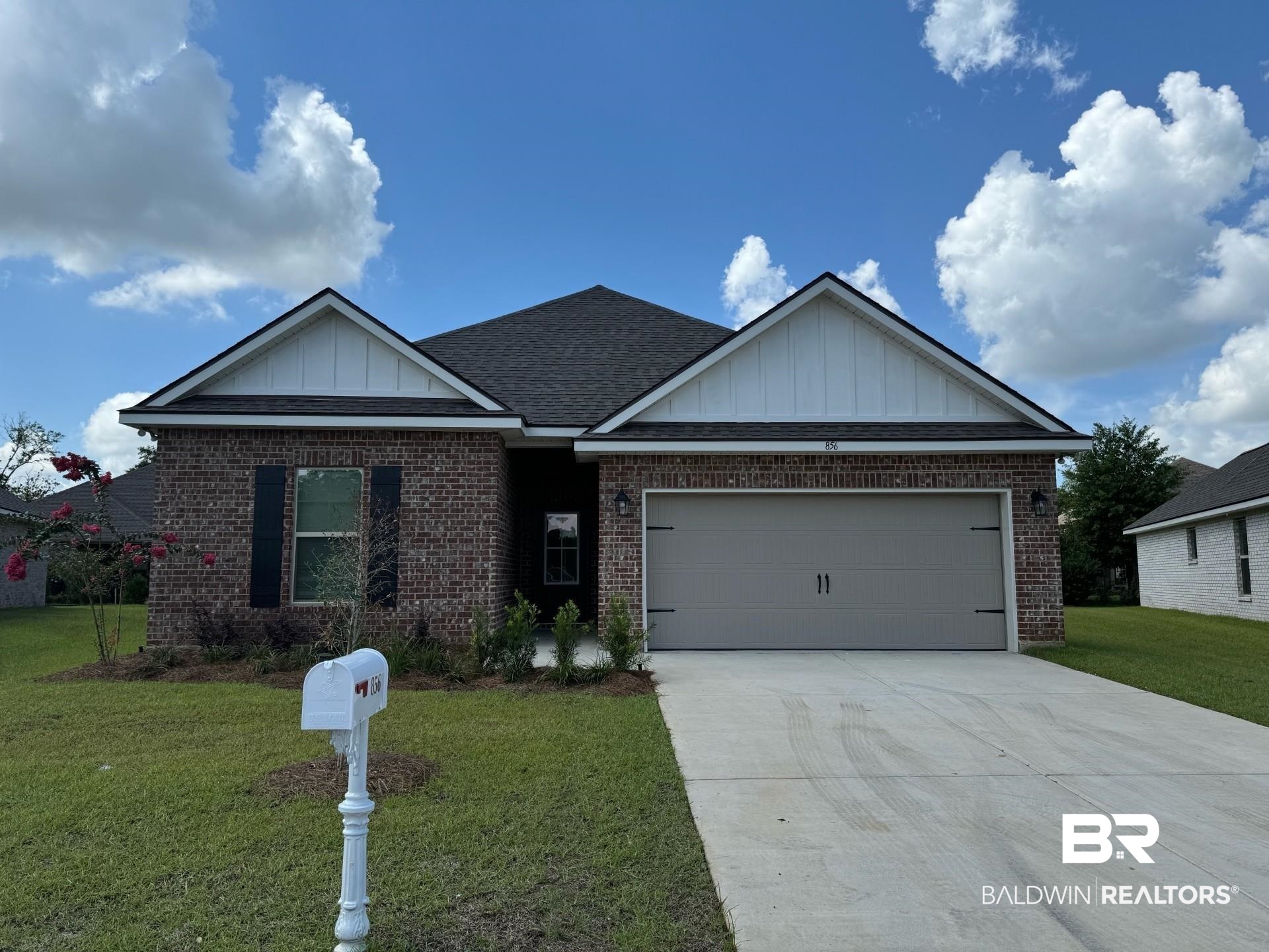 856 Sumter Loop Foley, AL 36535 - Photo 1 of 3 View of front of property featuring a garage and a front yard