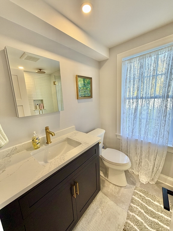 48 Springs Road, Unit RD Bedford, MA 01730 - Photo 12 of 27 a bathroom with a sink and a mirror