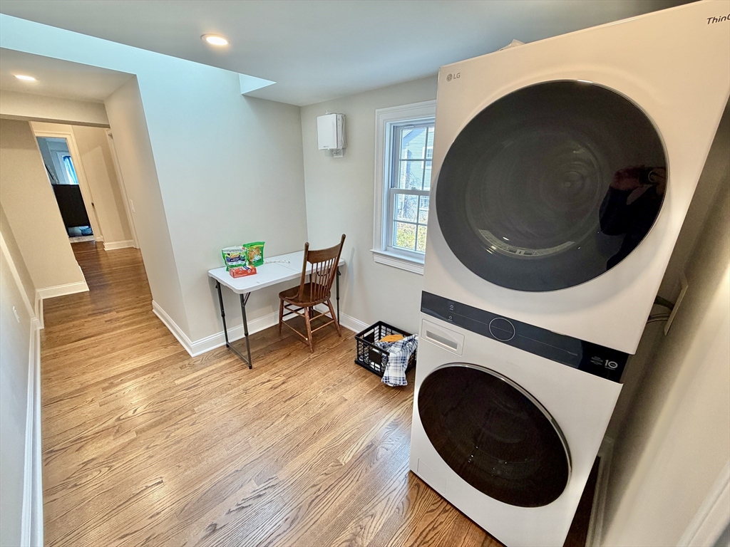 48 Springs Road, Unit RD Bedford, MA 01730 - Photo 18 of 27 a living room with toilet and a wooden floor