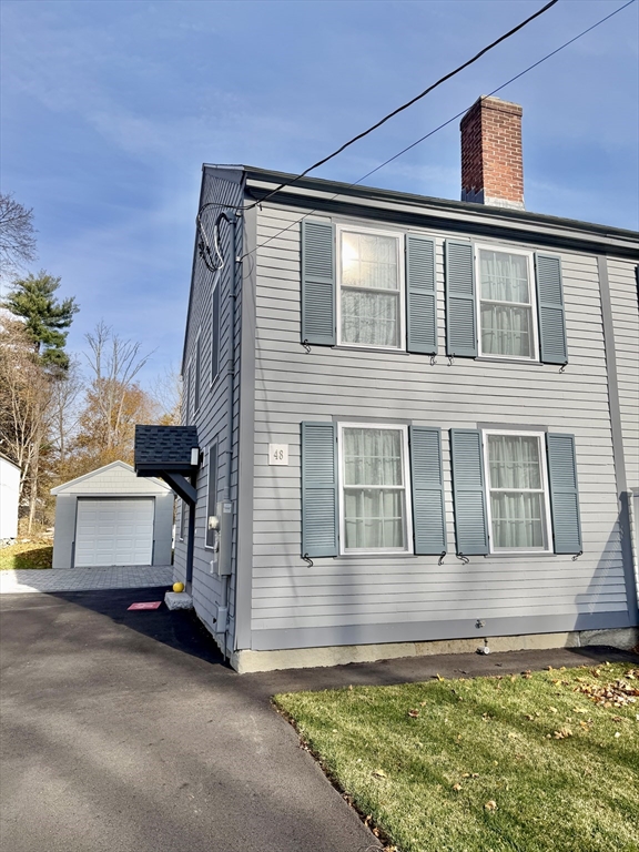 48 Springs Road, Unit RD Bedford, MA 01730 - Photo 2 of 27 a front view of a house with a yard