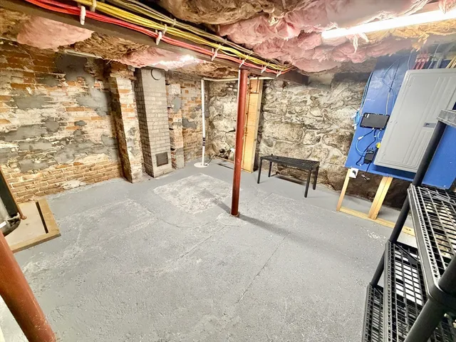 a view of living room with furniture and a rug