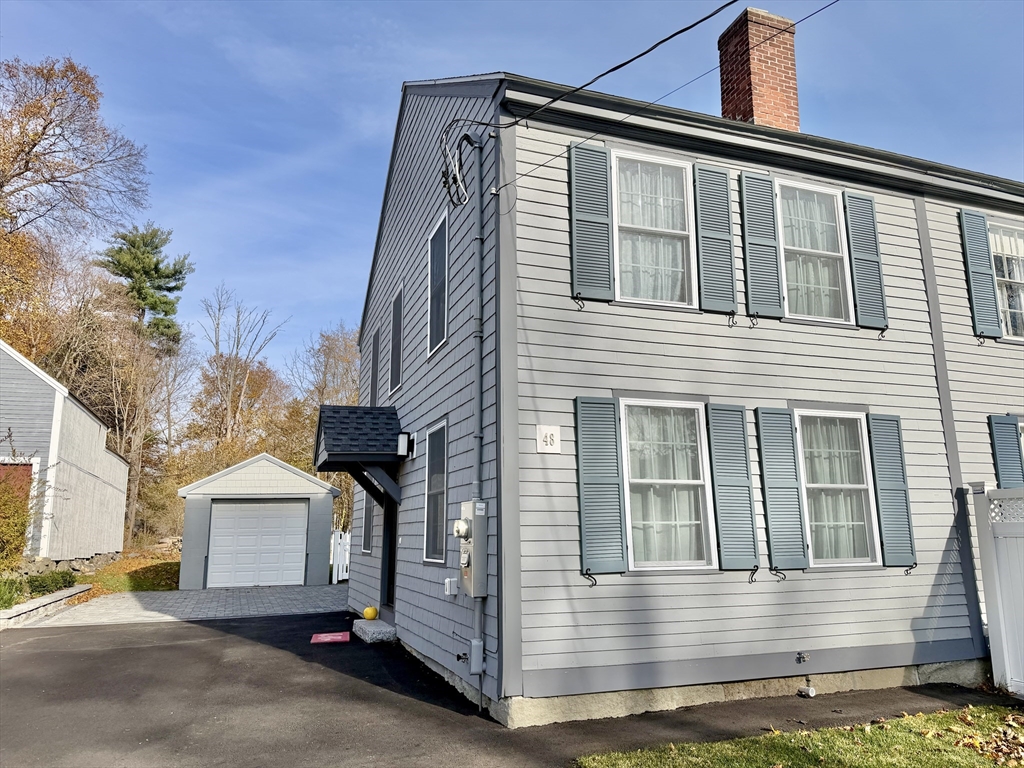 48 Springs Road, Unit RD Bedford, MA 01730 - Photo 3 of 27 a front view of a house with a yard