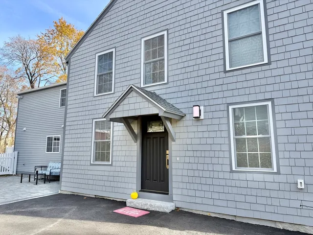 a front view of a house with garage