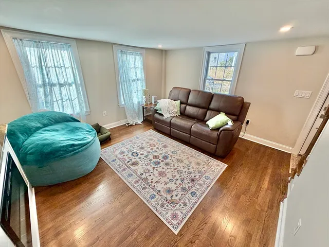 a living room with furniture and a rug