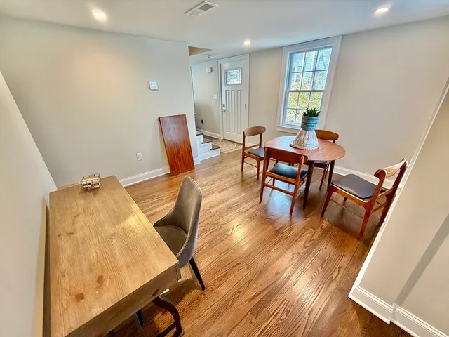 a workspace with furniture and wooden floor