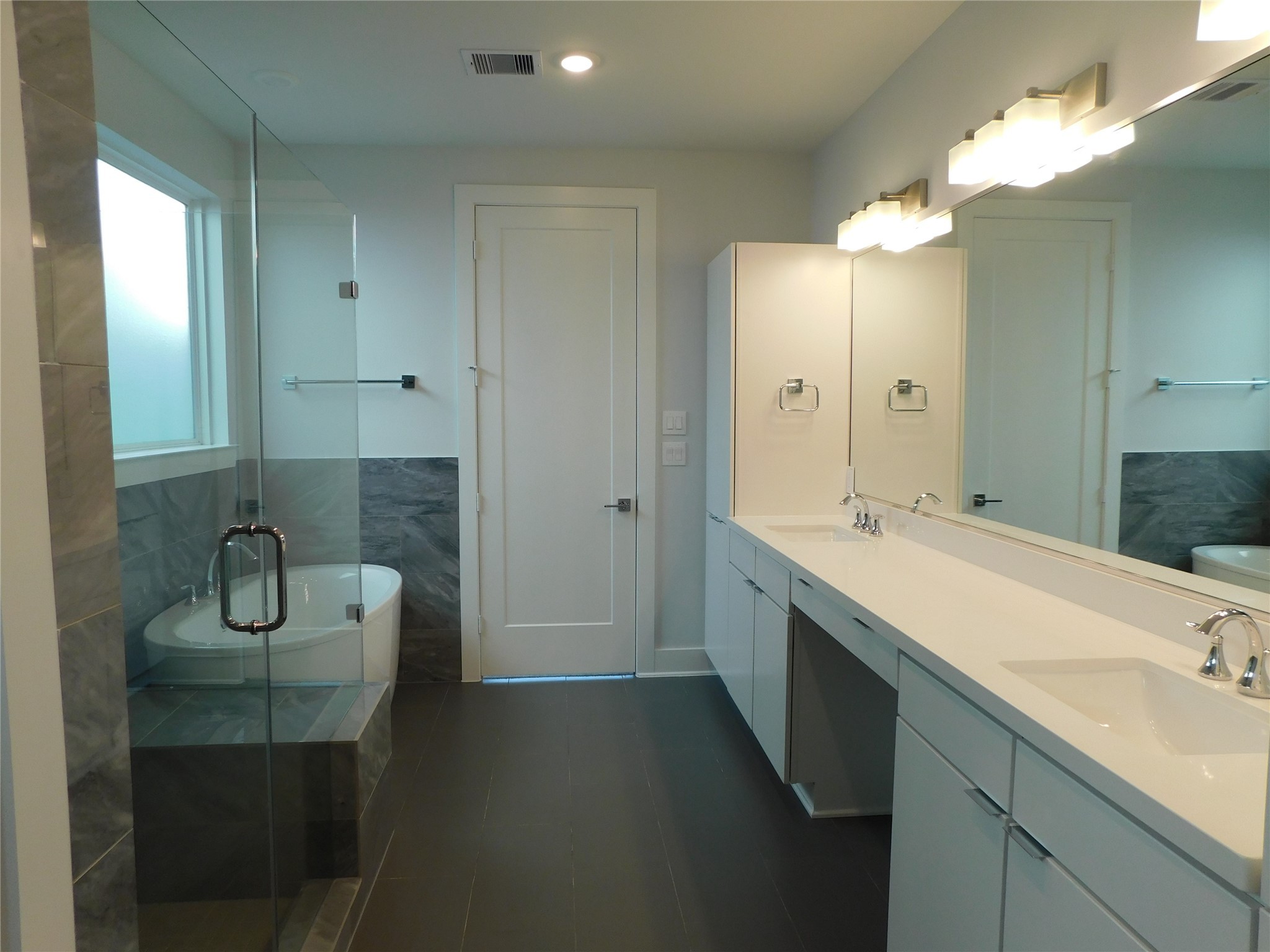 4223 Eli Street Houston, TX 77007 - Photo 23 of 46 a bathroom with a double vanity sink a toilet and a mirror