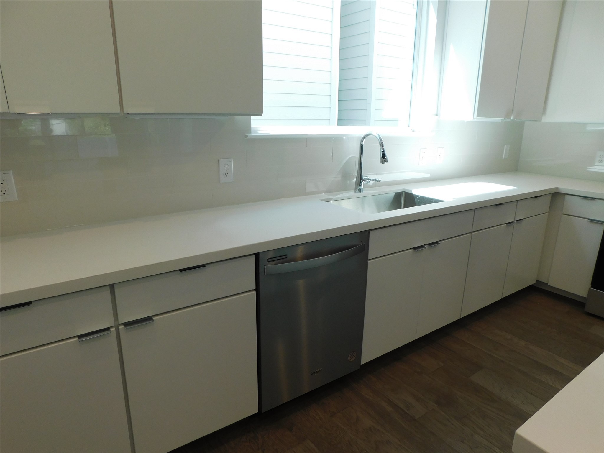 4223 Eli Street Houston, TX 77007 - Photo 29 of 46 a kitchen with a sink cabinets and a window
