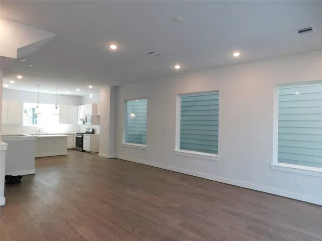 a view of a kitchen with a sink and a window