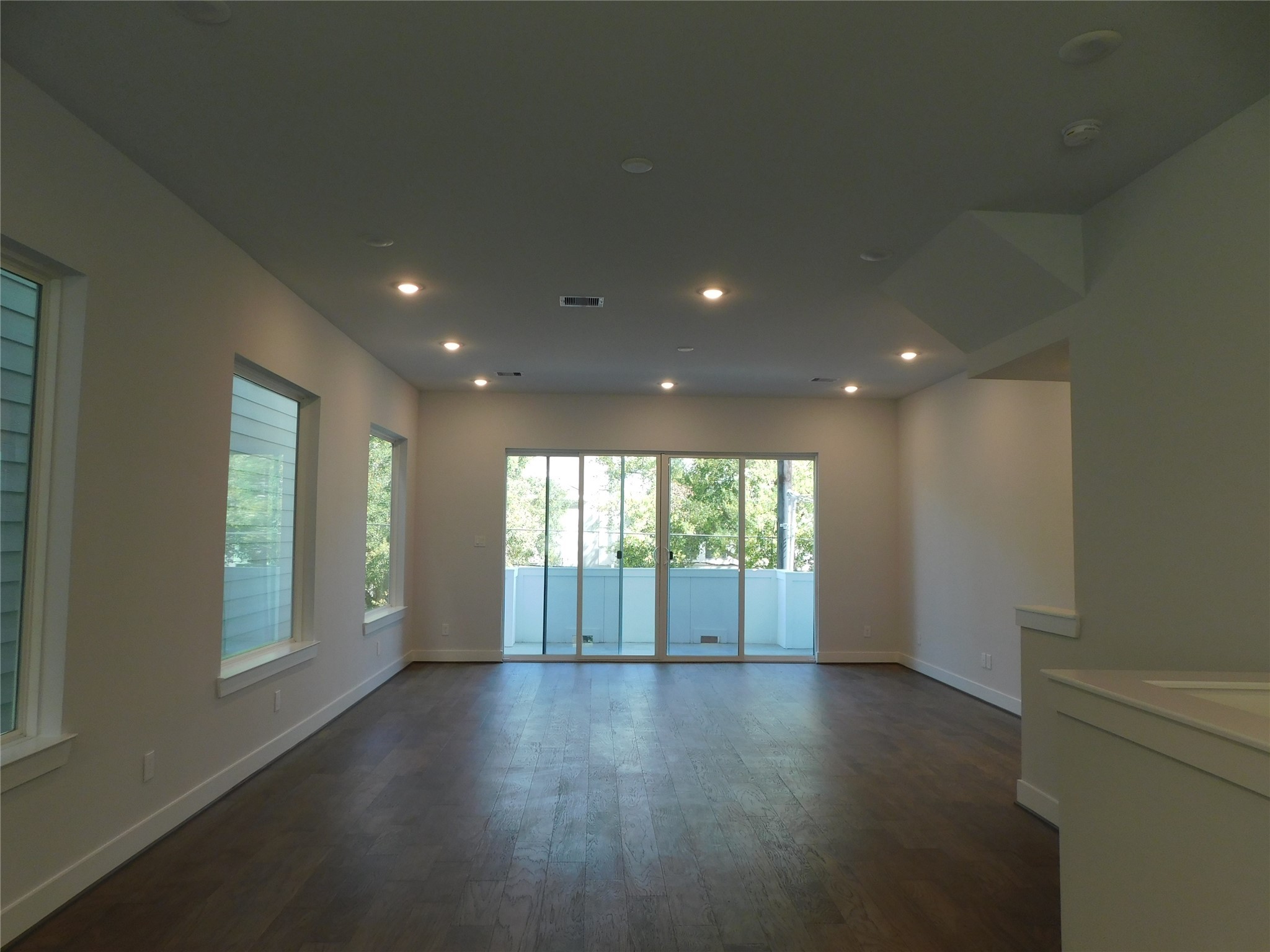 4223 Eli Street Houston, TX 77007 - Photo 9 of 46 an empty room with wooden floor and windows